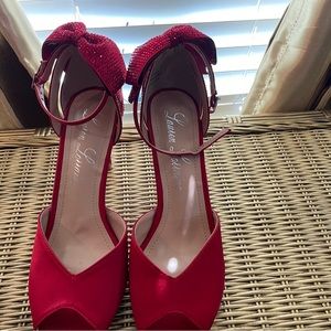 Red heels absolutely gorgeous with a little bling to them.